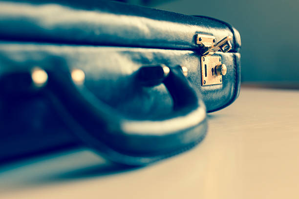 istock closeup of an old brown shabby brief case being opened 487639270