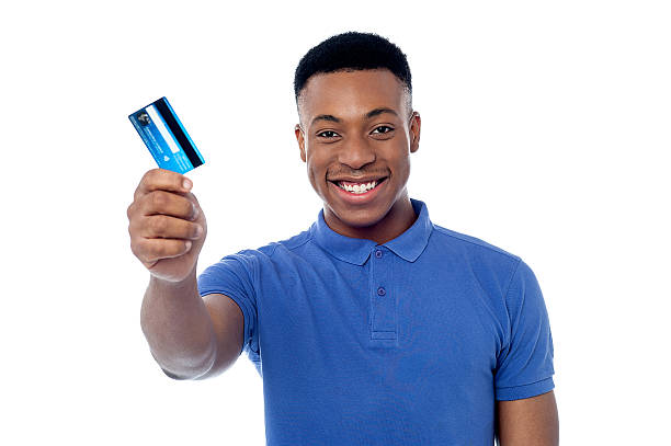 istock Smiling guy holding credit card 487649045