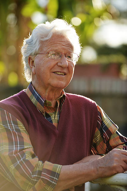 istock Senior man is sitting in the garden 487650825