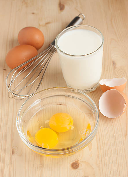 istock Raw chicken eggs and a glass of milk 487651217