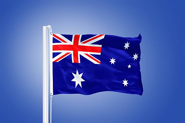 istock Flag of Australia flying against a blue sky 487652438