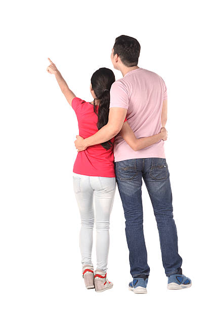 istock Young asian couple pointing something 487653246