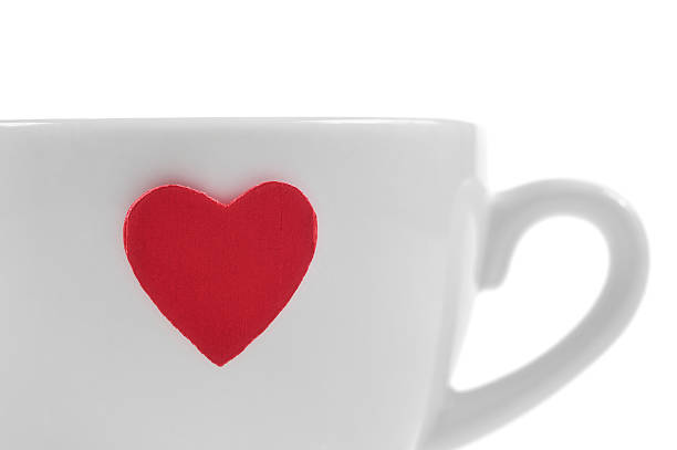 istock Coffee cup with red heart isolated on white 487654323