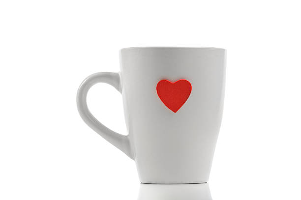istock Cup with red heart isolated on white 487654333