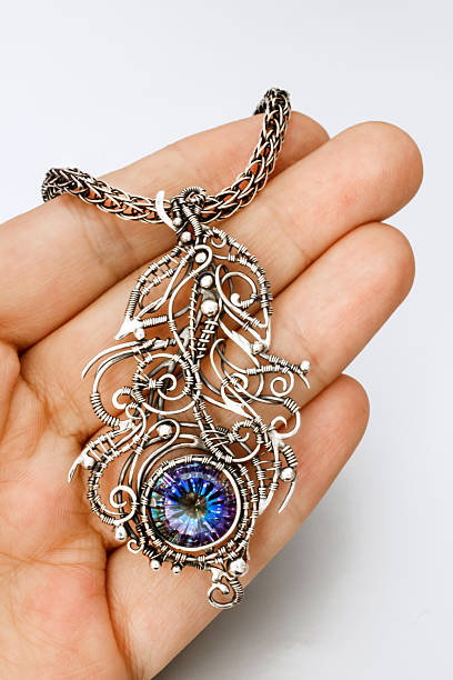 Silver mystic topaz feather pendant stock photo