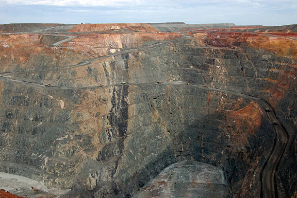 istock Trucks in Super Pit gold mine Australia 487654972