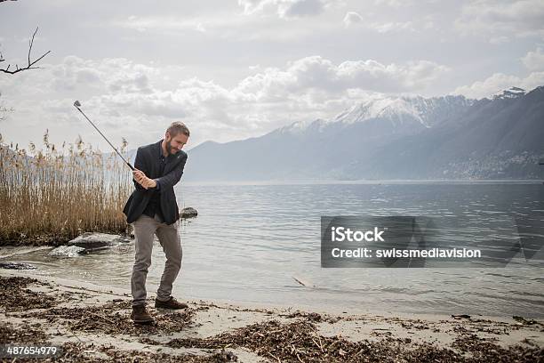 Young Business Man Golf Swing Stock Photo - Download Image Now - Businessman, Golf, Golfer