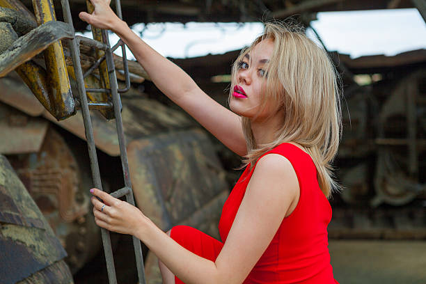 istock beautiful asian women climbing on ladder 487655164