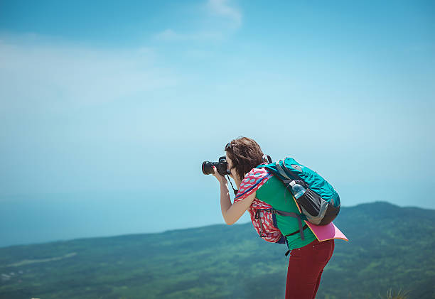 istock Young woman photographing 487655396