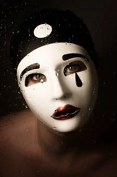 a portrait with Pierrot mask with tears