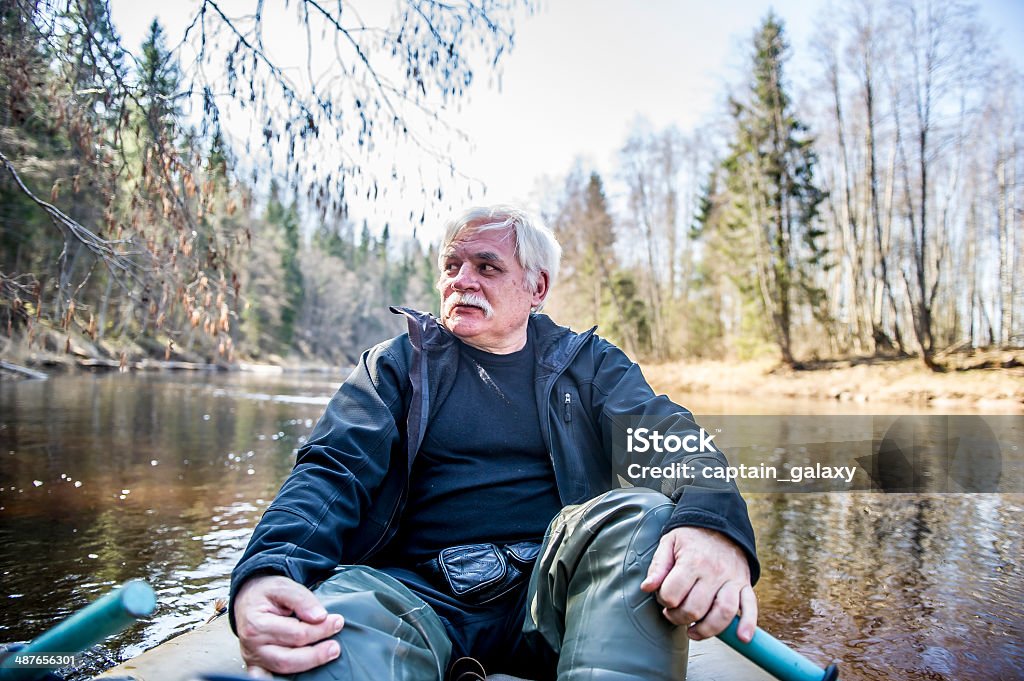 The descent down the Lemovzha river in a rubber boat The man commit descent in a rubber boat on the river Lemovzha. The descent down the Lemovzha river in a rubber boat. Lemovzha - a river in Russia, a right tributary of Luga, flows Volosovsky district of Leningrad region. Starts from the confluence of the Black and Izvarki the village Black falls into Lugu 128 km from its mouth, near the village of Lemovzha. The river is 48 km, drainage area 839 km ². Lemovzha flows through settlements (from source to mouth): Sosnica, Masani Gorka Hotnezha, squirm, Lemovzha. Activity Stock Photo