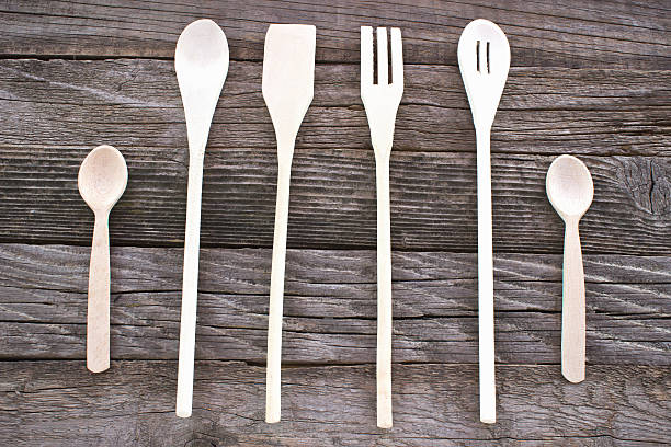 istock Wooden cutlery set on wooden background 487660484