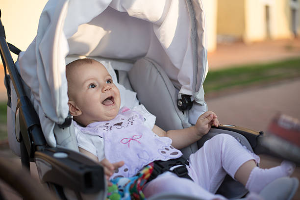 istock baby laughing  in a baby carriage 487661016