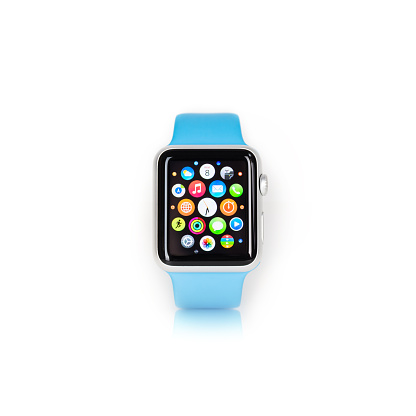 Florence, Italy - September 8, 2015: Studio shot of an Apple watch sport edition with blue strap on white background. The watch is open on the home screen page.
