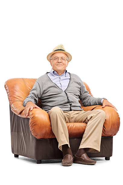 istock Relaxed senior gentleman sitting in an armchair 487664172