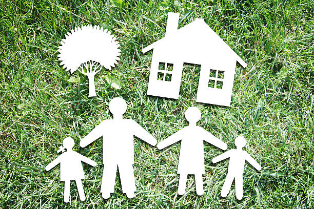 istock Happy family characters on backdrop of green grass 487664292
