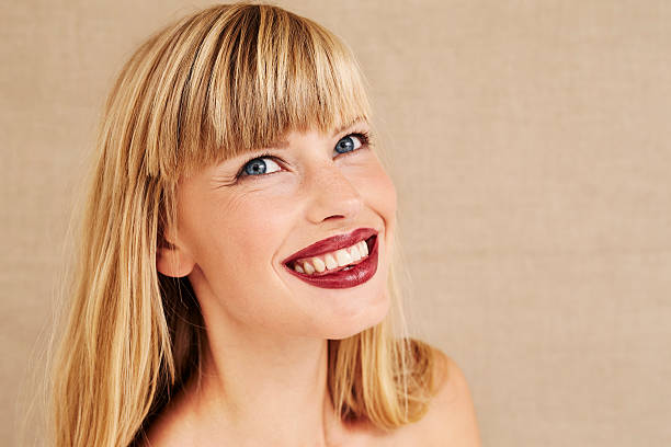 istock Attractive young woman looking up 487664790
