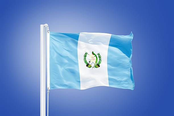 istock Flag of Guatemala flying against a blue sky 487665542