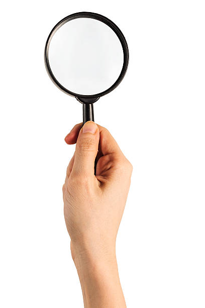 istock Magnifying Glass in Holding Hand 487666416