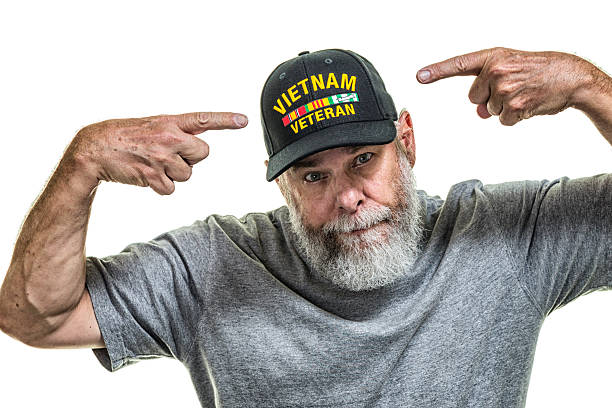 istock Vietnam War US Navy Military Veteran Pointing At Hat 487666572
