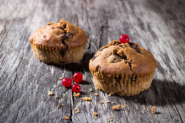 istock Chocolate muffins on the wood background 487667320