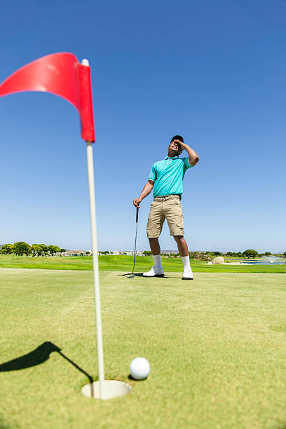 istock African golfer disappointed about his miss 487667741