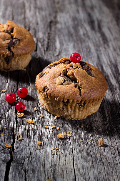istock Chocolate muffins on the wood background 487667954