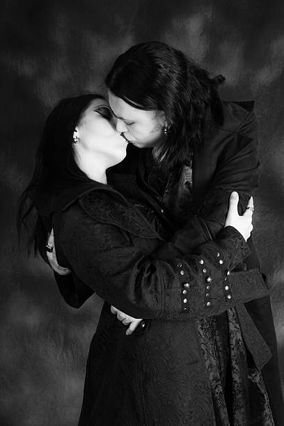 istock B&W of Goth Vampire lovers embracing and kissing. 487668006
