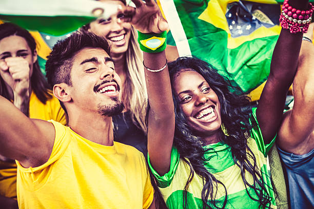 istock Brazilian Supporters Cheering at the Stadium 487669095