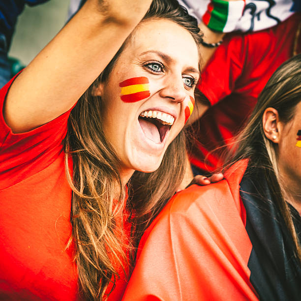 istock Spanish Young Woman Cheering at the Stadium 487669133