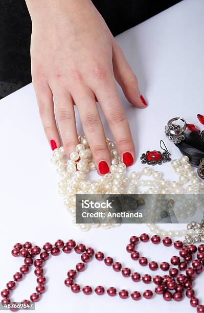 Female Hand Choosing Pearl Necklace Stock Photo - Download Image Now - Adult, Arts Culture and Entertainment, Bead