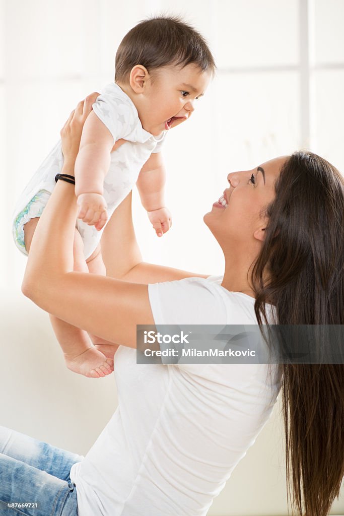 Mother and baby Mother and baby playing at home. 6-11 Months Stock Photo