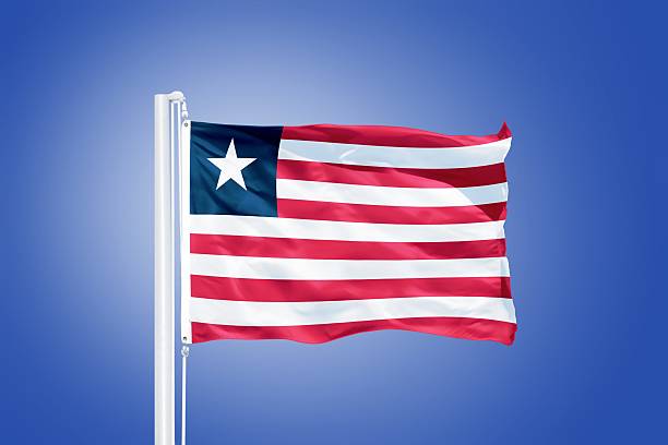 istock Flag of Liberia flying against a blue sky 487671306
