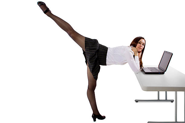 istock Dancing Businesswoman with a Computer on a White Background 487671533