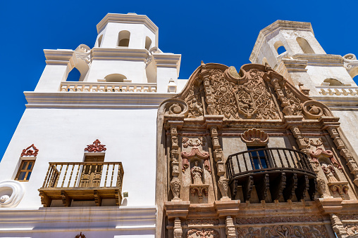 San Xavier del Bac Mission, White Mission Church Building, Tucson, Arizona. Archtecture close-up, Clear blue sky