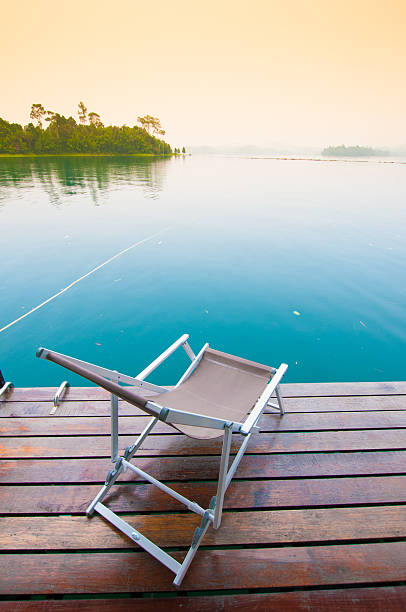 istock Beach chairs on perfect tropical lake 487672490