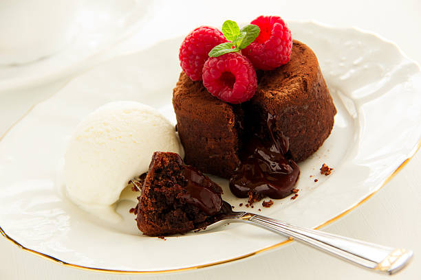 istock Chocolate fondant (pudding) with raspberries. 487672625