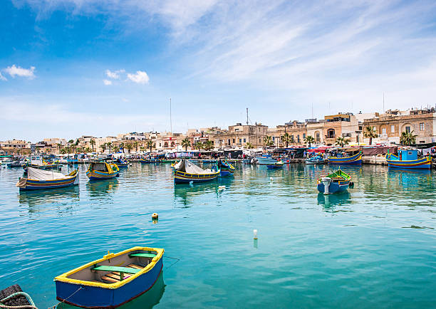 istock boats in Marsaxlokk harbor 487673364