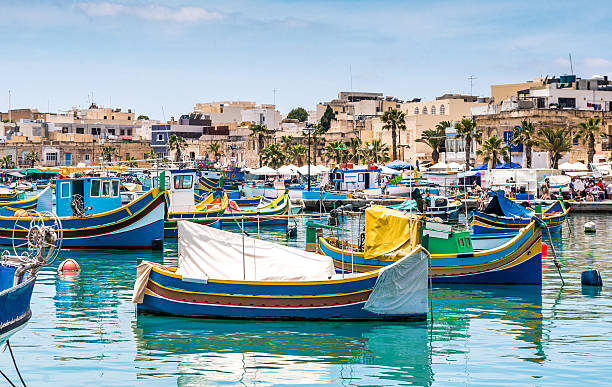 istock boats in Marsaxlokk harbor 487673366