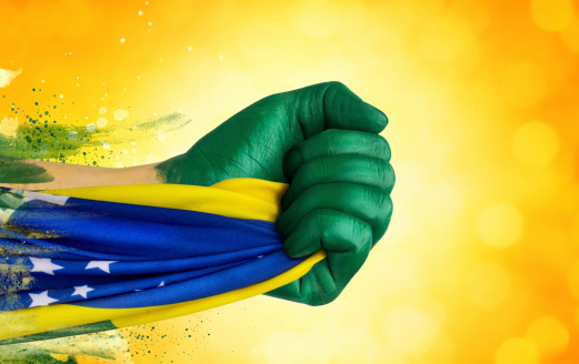Hands painted in Brazilian colors.