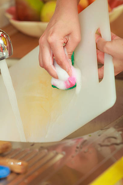 istock Woman doing the washing up in kitchen 487673838