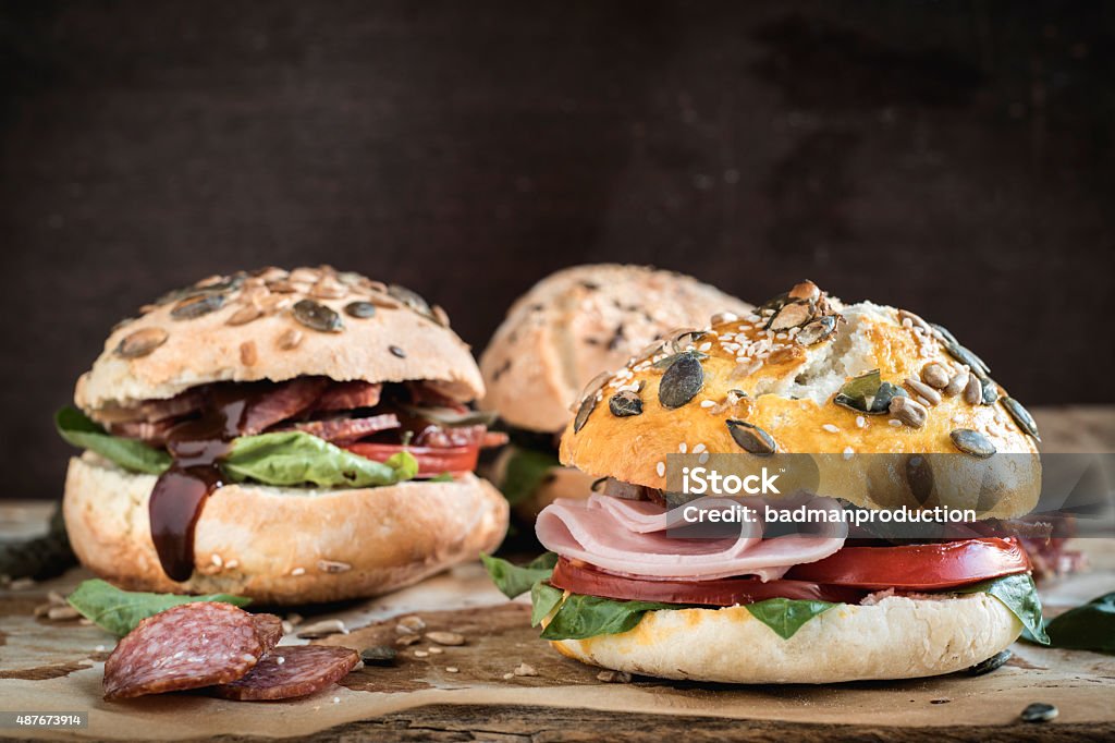 Juicy sandwiches Juicy sausages sandwiches in homemade buns,selective focus and blank space 2015 Stock Photo