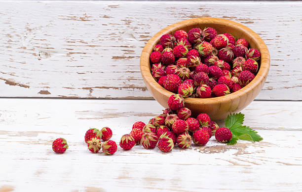 Wild Strawberry In A Plate On A Table Stock Photo - Download Image