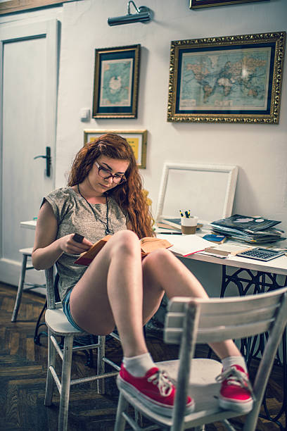 istock Young relaxed woman enjoying in a book. 487677686