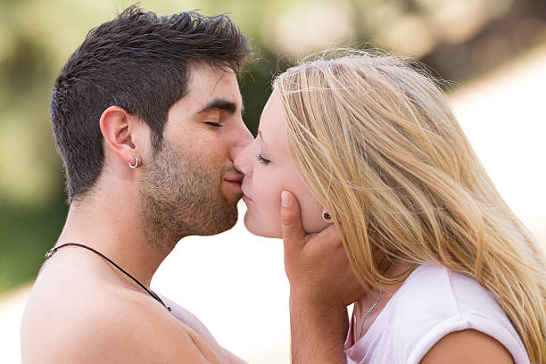 istock young beautiful couple kissing 487678640