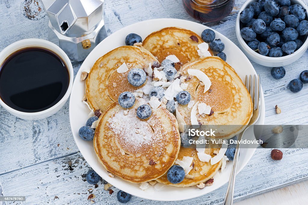 pancakes with fresh blueberries and honey for breakfast pancakes with fresh blueberries and honey for breakfast, top view, horizontal 2015 Stock Photo