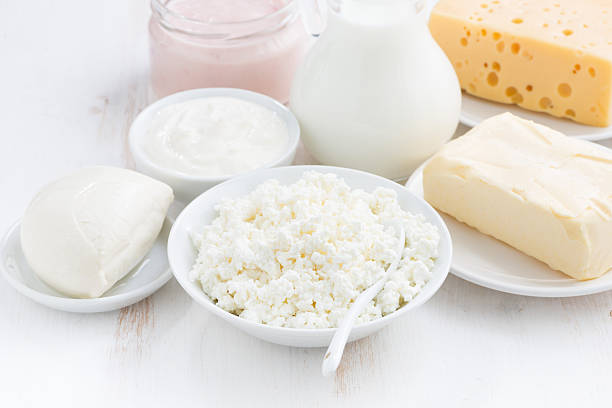 istock dairy products on white wooden table 487678798