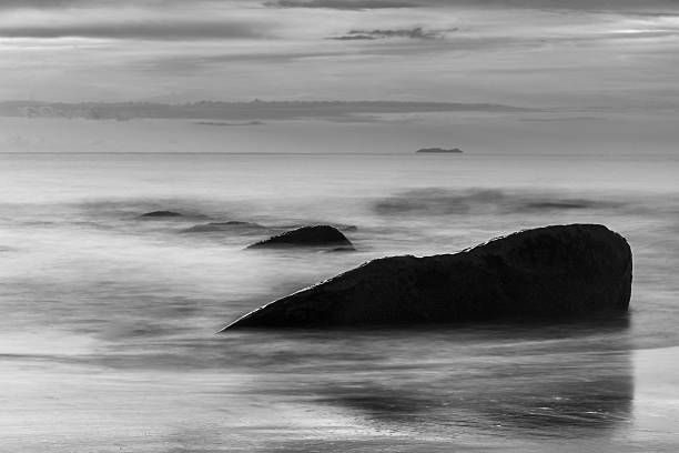 istock Black coast. Beautiful daytime long exposure photo 487680910