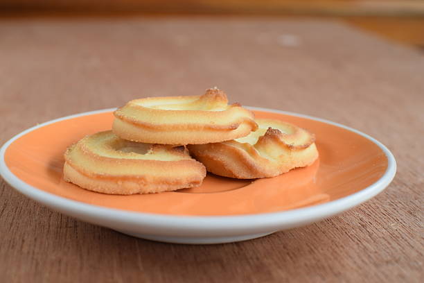 istock Cheese cookies in orange plate 487683422