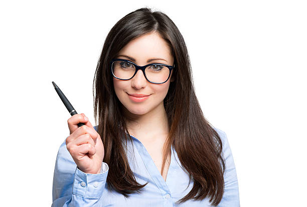 istock Young smiling woman holding a pen 487683478